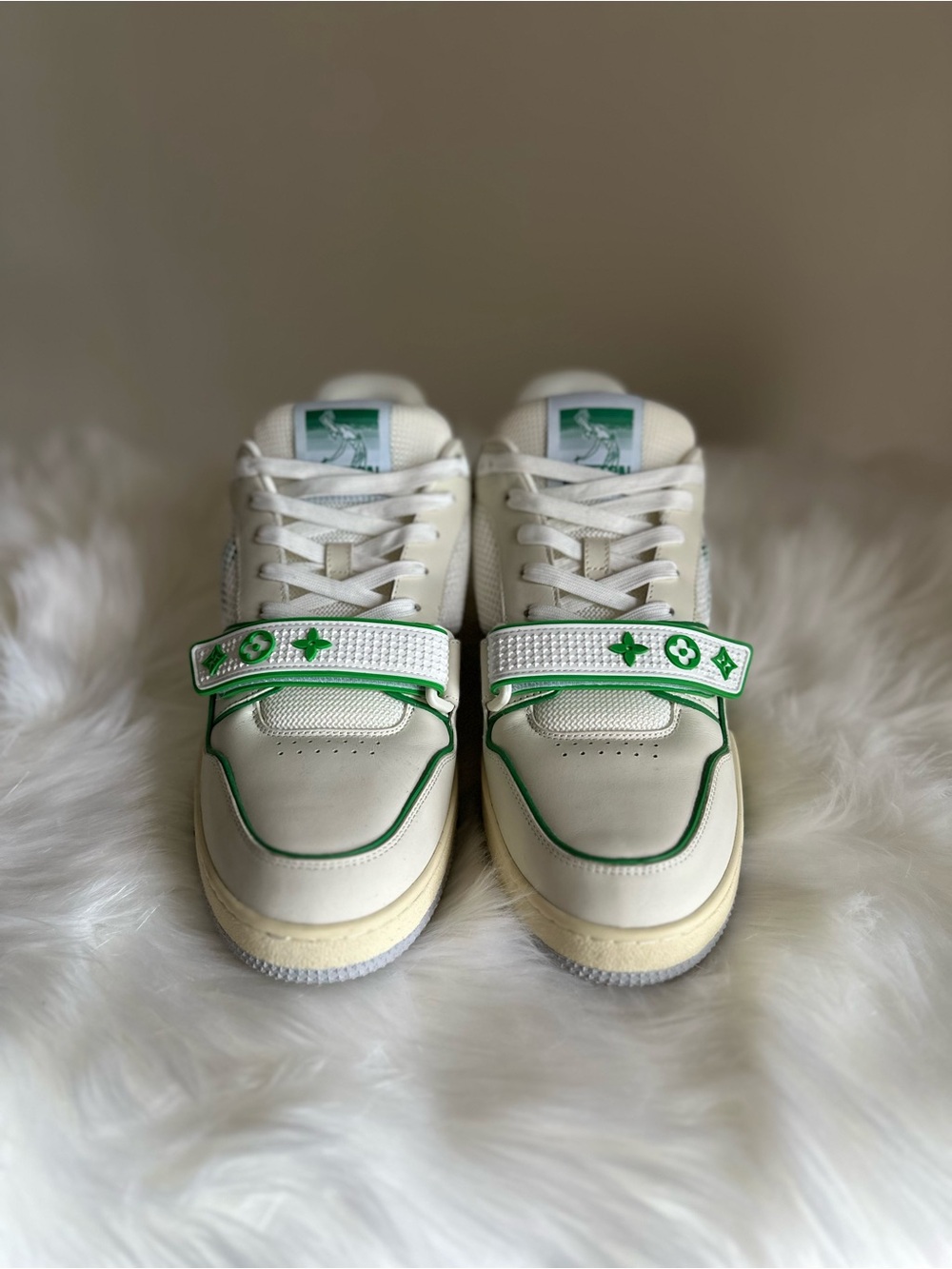 Louis Vuitton men's white & green low-top sneakers with monogram strap.